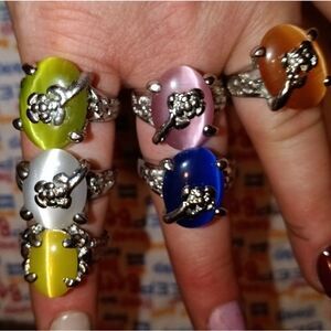 Six large fashion rings, silver with a design going up one side, NWOT